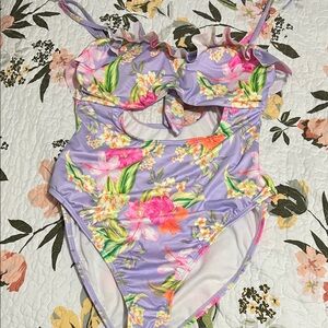 Hurley Lavender and Pink Floral Swim one-piece with mid cut-out and ruffle.